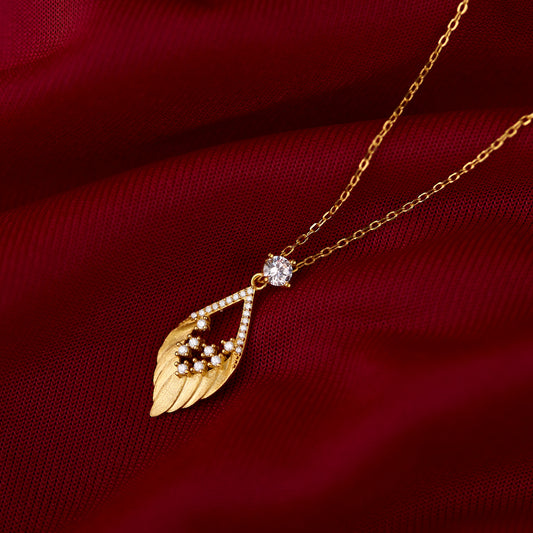 Necklace with blue and white beads and a gold pendant on a gold background