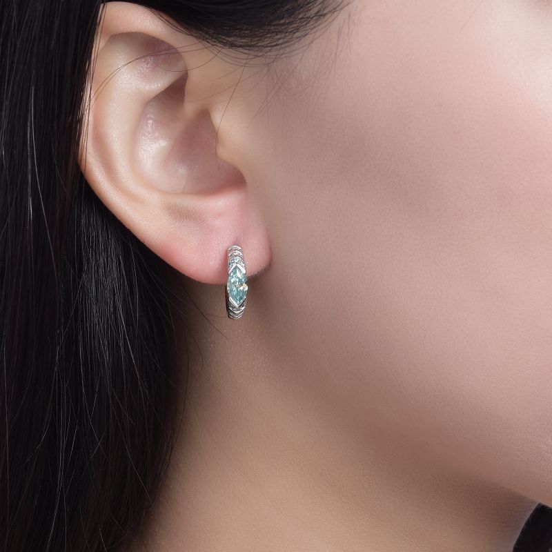 Female model wearing the earrings on ears.