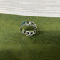 Gucci 925 Silver Turquoise Chain Ring with leaf design on a green patterned surface