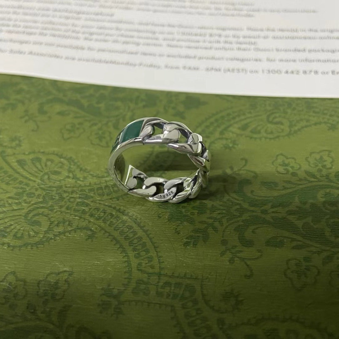 Gucci 925 Silver Turquoise Chain Ring with leaf design on a green patterned surface