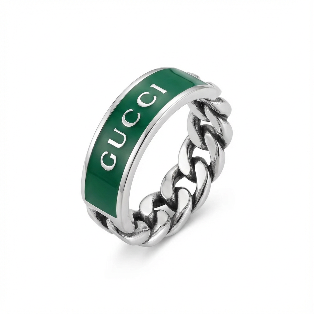 Gucci ring with green enamel and silver chain design on a white background