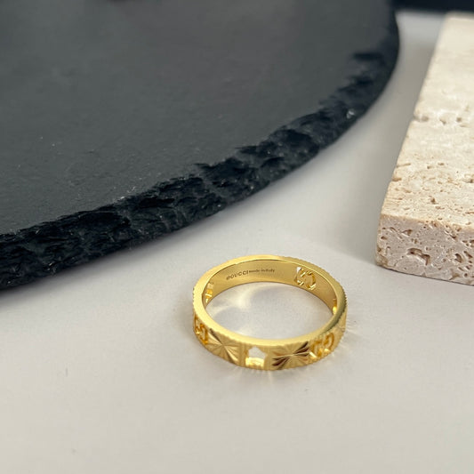 “Gucci Icon Star ring 18K yellow gold flat lay”