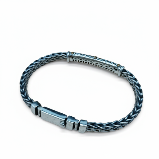 Handcrafted Dragon Bone BraceletSilver braided bracelet on a white background