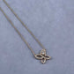 “Harry Winston Infinite Lily Cluster diamond pendant necklace flat lay”