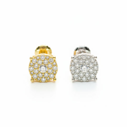 Gold and silver earrings with clear gemstones on a white background