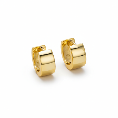 Huggie Earring Sterling SilverPair of gold hoop earrings on a white background