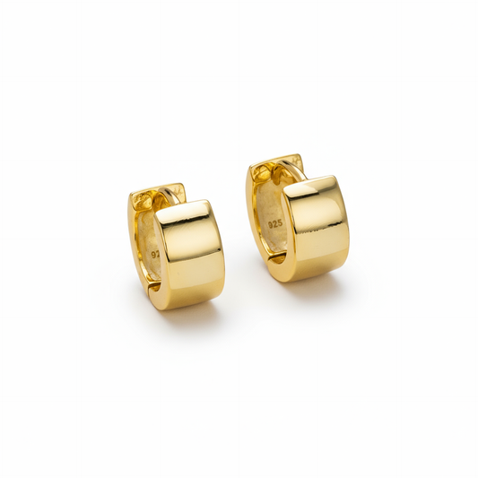 Huggie Earring Sterling SilverPair of gold hoop earrings on a white background