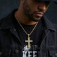  Man in a hoodie and sneakers, the swirl iced-out cross resting prominently on the chest — bold, confident, unique.