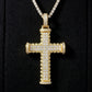 Clean black or dark background (to maximize sparkle contrast) — the iced-out moissanite SWIRL cross pendant displayed on a bust form or flat surface. The flowing curved silhouette catches light from multiple angles, showcasing the organic movement and exceptional moissanite fire.