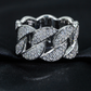 Silver bracelet with intricate design on a black fabric background