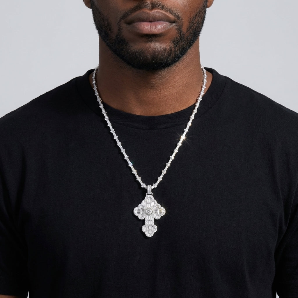 Man in a hoodie and sneakers, the iced out cross resting prominently on the chest — bold, confident, authentic.