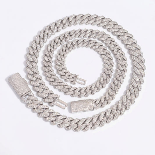 Clean black or dark background (to maximize sparkle contrast) — the iced out moissanite Cuban link chain displayed flat or on a bust form. Every single link is fully pavé with moissanite stones, catching bright light and showcasing exceptional fire, brilliance, and maximum ice coverage.