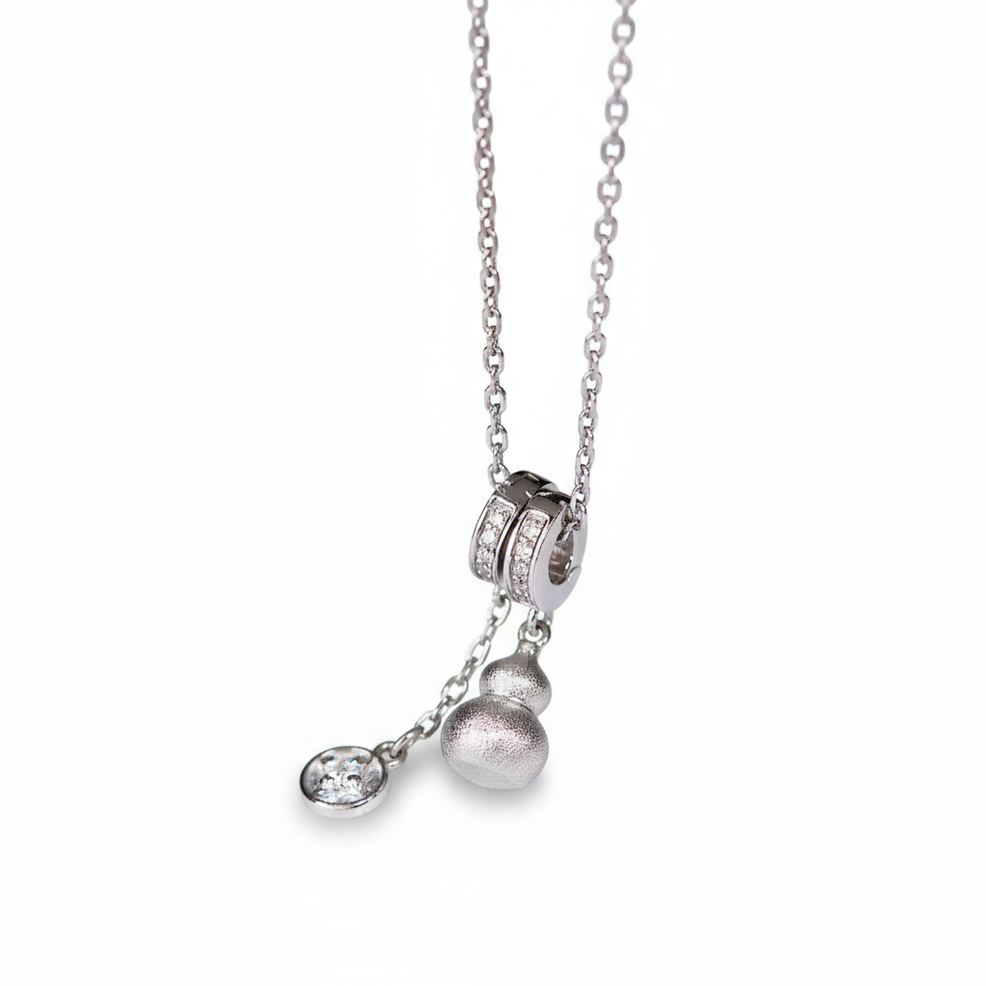 Silver necklace with pendant on a white background