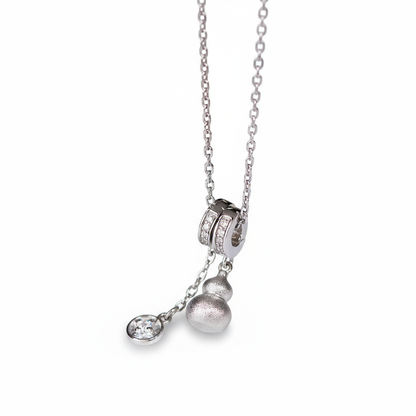 Silver necklace with pendant on a white background