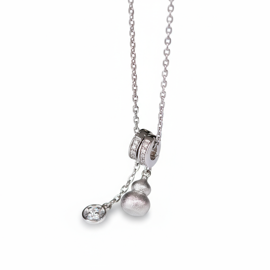 Silver necklace with pendant on a white background
