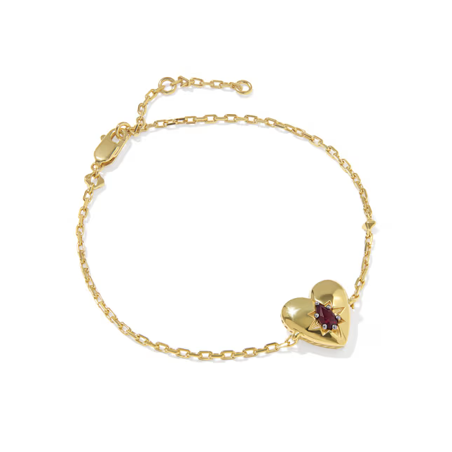Gold bracelet with a heart-shaped clasp on a white background