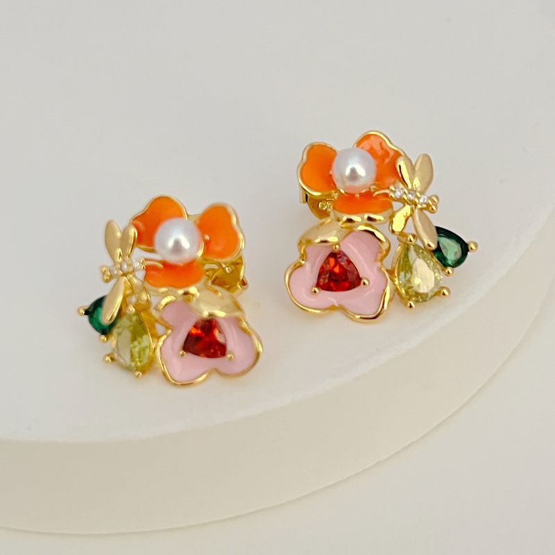 Earrings on a soft white or pale pink background, showcasing the vibrant multicolor floral cluster. Alt: “Kate Spade Abloom in Color Floral Cluster Stud Earrings – Multicolor Enamel Flower Jewelry.”