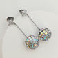 Earrings on a soft black or silver glitter background, showcasing the linear cascade of mirror tiles catching light. Alt: “Kate Spade Beaming Bright Disco Ball Linear Earrings – Mirror Tile Drop Jewelry.”