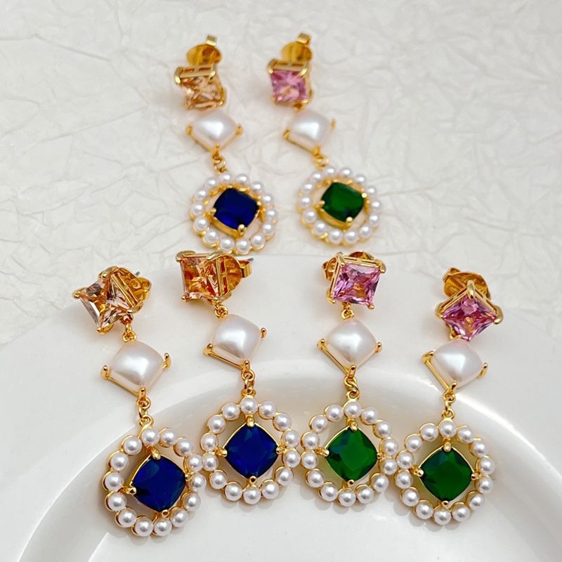 Earrings on a soft ivory or dusty blue background, showcasing the serene blue pearl center surrounded by a pavé crystal halo. Alt: “Kate Spade Blue Pearl Earrings – Gold & Blue Bridal Halo Jewelry.”