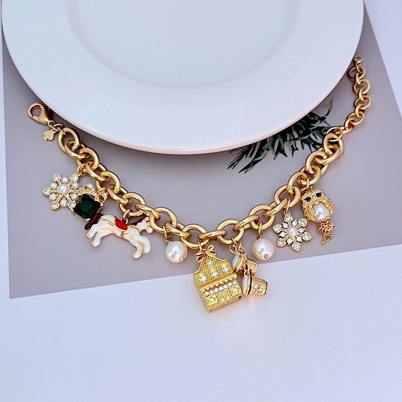 Macro focus on the carousel horse with its colorful saddle and the owl's detailed feather enamelwork. Alt: “Enamel Carousel Horse & Owl Charm Detail – Kate Spade.”