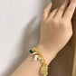 Bracelet styled alongside vintage carousel figurines, fairy lights, or a storybook for a nostalgic, magical aesthetic. Alt: “A Touch of Magic: Styling the Kate Spade Carousel & Owl Bracelet.”