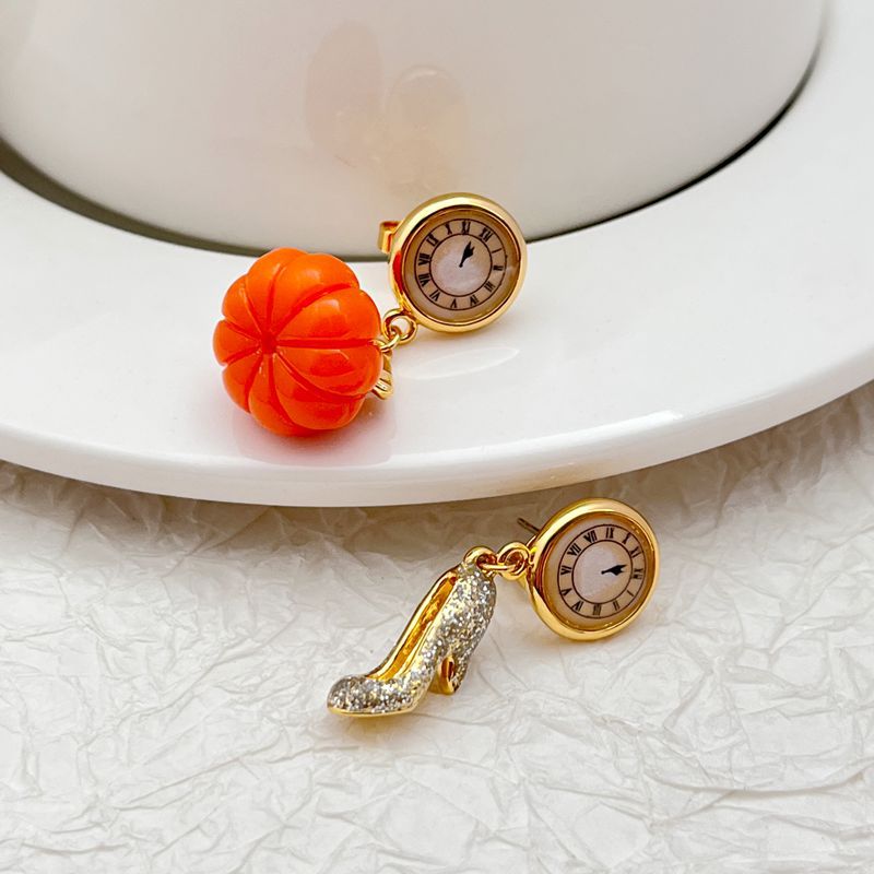  Earrings displayed side by side on a soft midnight blue or fairy tale-inspired background, showcasing the glass slipper heel and pumpkin clock charms. Alt: “Kate Spade Cinderella High Heels and Pumpkin Clock Earrings – Fairy Tale Novelty Jewelry.”