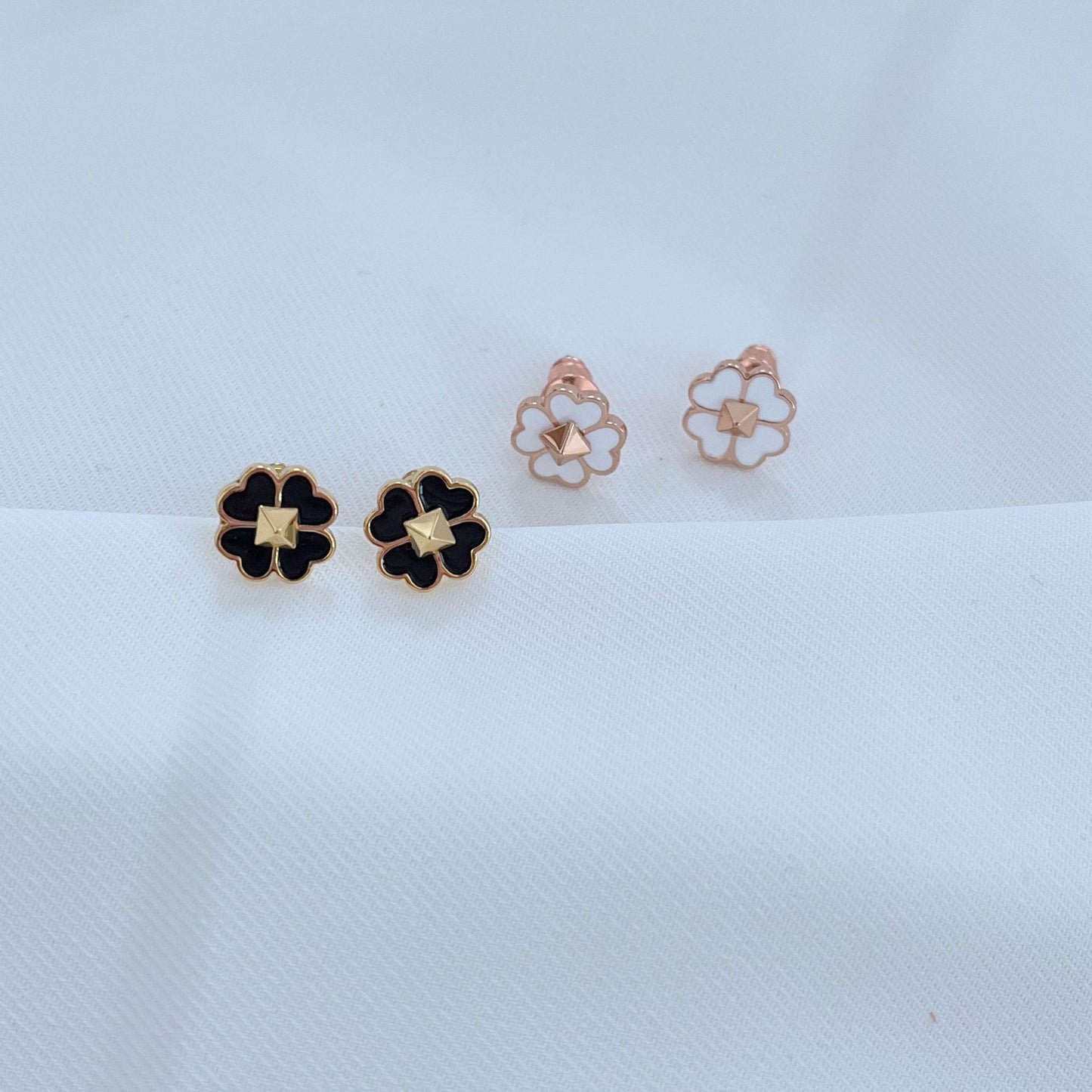 The necklace styled next to a deck of cards, a lucky coin, or on a minimalist surface, reinforcing themes of luck and modern design.