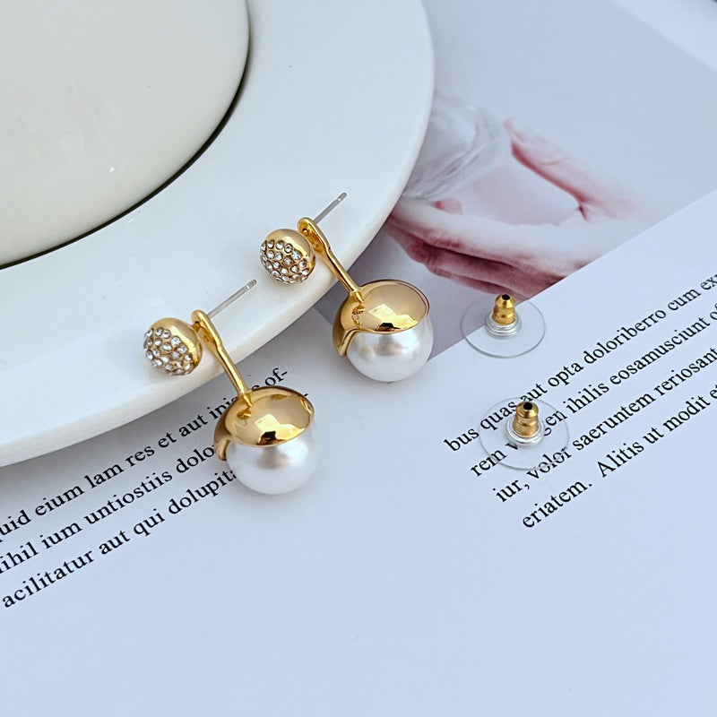 Earrings on a soft blush or cream background, showcasing the luminous faux pearl with crystal-accented cap. Alt: “Kate Spade Dainty Sparklers Faux Pearl Earrings – Crystal & Pearl Drop Jewelry.”