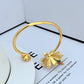  Cuff bangle on a clean white or soft blush background, highlighting the crystal daisy and pearl center. Alt: “Kate Spade Dazzling Daisy Flex Cuff Bangle – Crystal Flower Bracelet.”