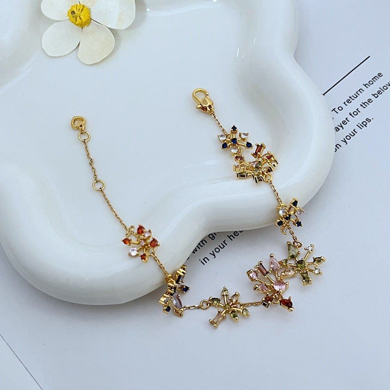 Bracelet on a deep navy or black background, making the crystal fireworks pop like stars in the night sky. Alt: “Kate Spade Firework Bracelet – Starburst Crystal Celebration Jewelry.”