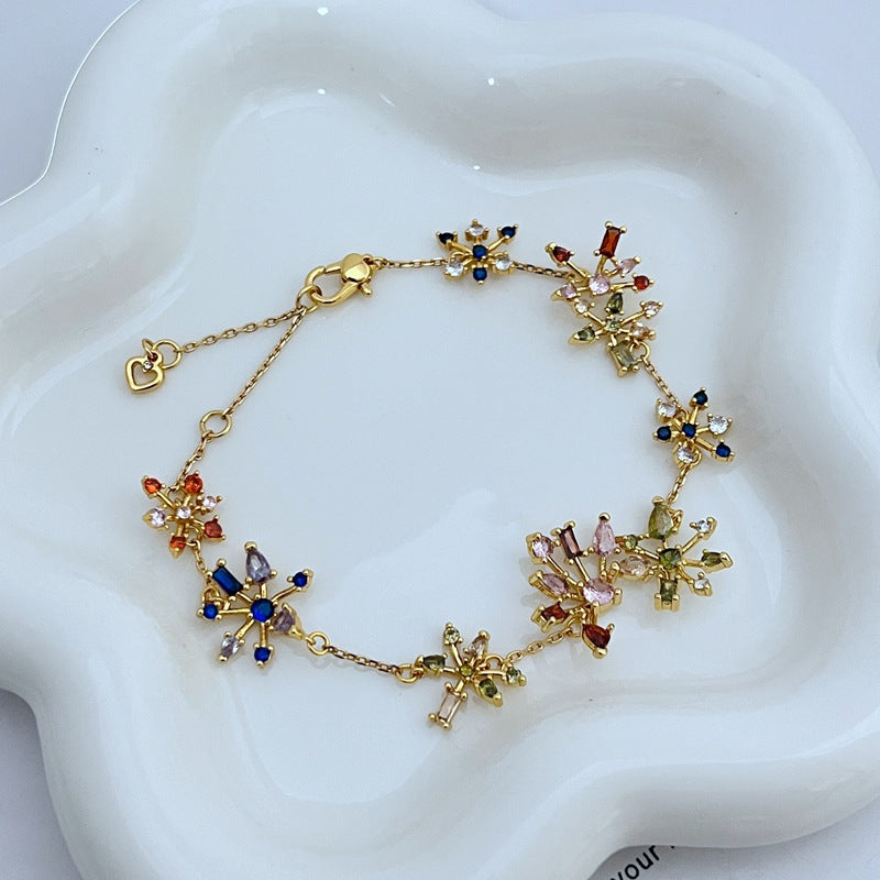 Bracelet on a deep navy or black background, making the crystal fireworks pop like stars in the night sky. Alt: “Kate Spade Firework Bracelet – Starburst Crystal Celebration Jewelry.”