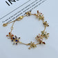 Bracelet on a deep navy or black background, making the crystal fireworks pop like stars in the night sky. Alt: “Kate Spade Firework Bracelet – Starburst Crystal Celebration Jewelry.”