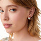  Earrings worn on a model with soft, romantic styling, showing their petite, colorful charm. Alt: “Vineyard Charm: Kate Spade Grape Studs for Everyday Elegance.”