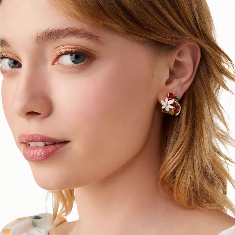 Earrings worn on a model with soft, romantic styling, showing their petite, colorful charm. Alt: “Vineyard Charm: Kate Spade Grape Studs for Everyday Elegance.”