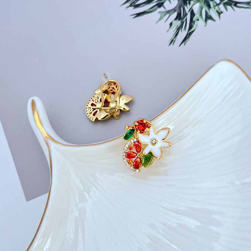 Earrings on a soft lavender or vineyard-inspired background, showcasing the glossy purple grape cluster and floral details. Alt: “Kate Spade Flower Grape Fruit Stud Earrings – Enamel Grape Jewelry Gift for Her.”