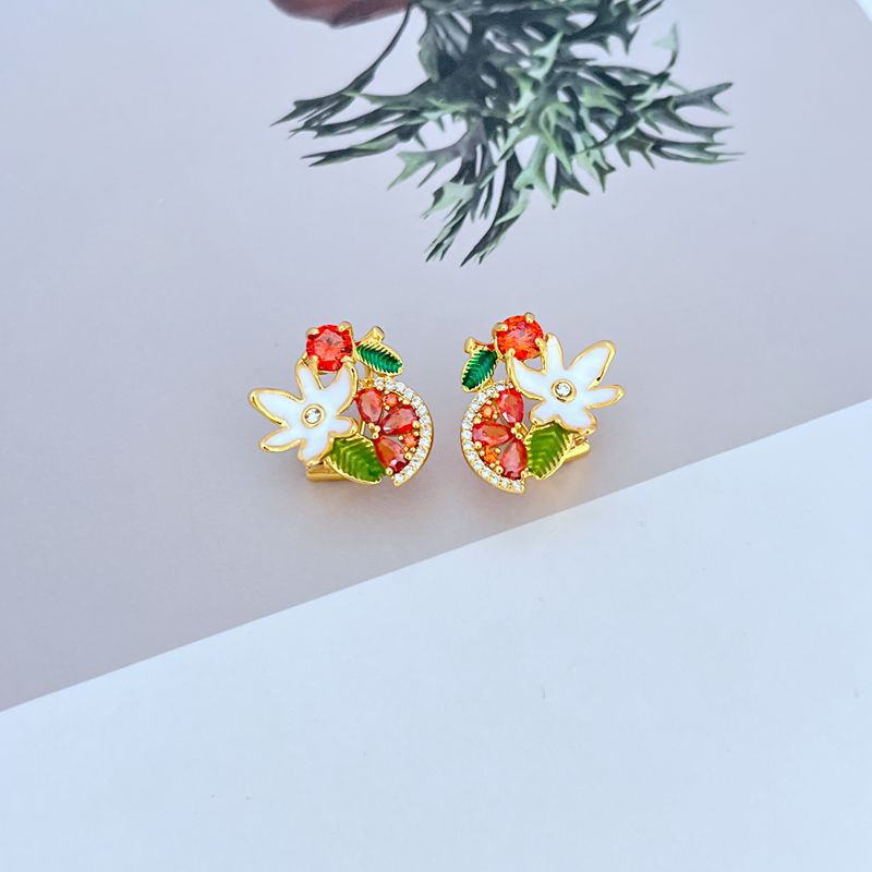 Earrings on a soft lavender or vineyard-inspired background, showcasing the glossy purple grape cluster and floral details. Alt: “Kate Spade Flower Grape Fruit Stud Earrings – Enamel Grape Jewelry Gift for Her.”