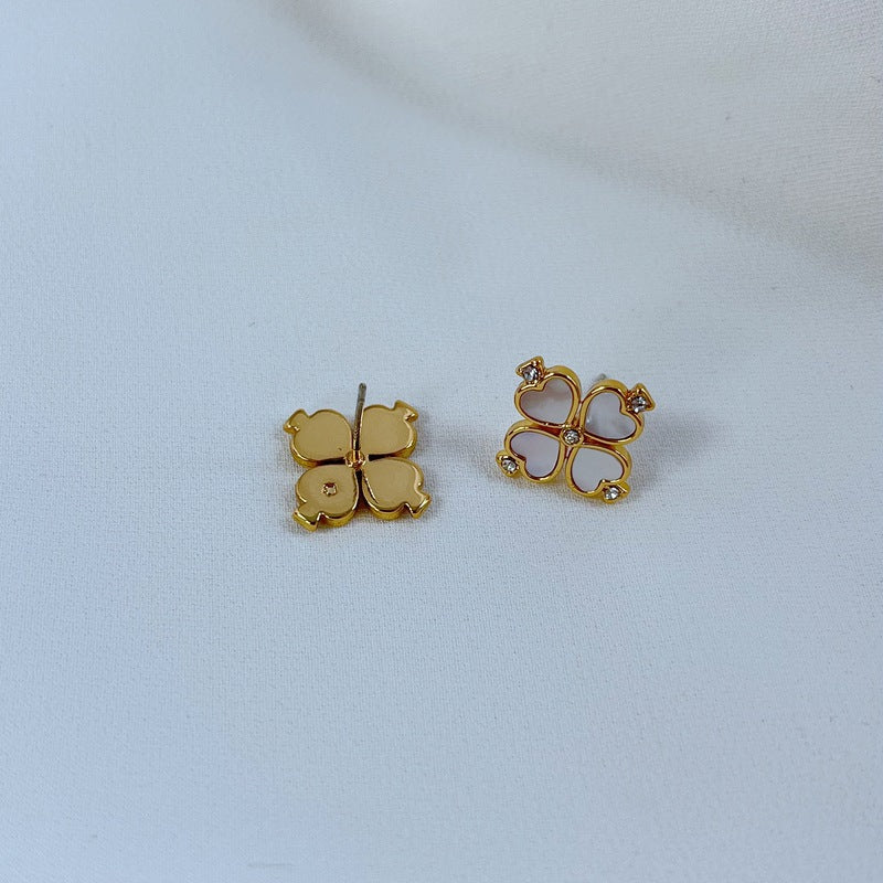 Silver-tone clover studs on a soft grey background, highlighting the crisp clover silhouette. Alt: “Kate Spade Silver Four Leaf Clover Earrings – Lucky Charm Jewelry.”