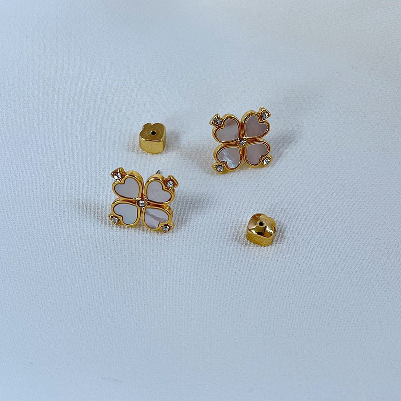 Silver-tone clover studs on a soft grey background, highlighting the crisp clover silhouette. Alt: “Kate Spade Silver Four Leaf Clover Earrings – Lucky Charm Jewelry.”