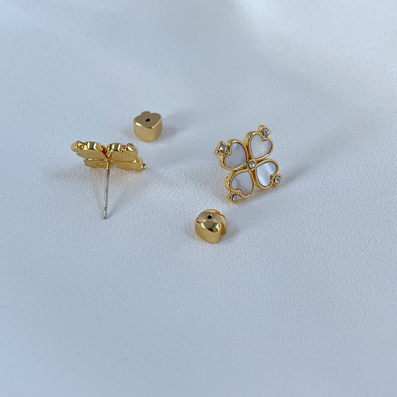 Silver-tone clover studs on a soft grey background, highlighting the crisp clover silhouette. Alt: “Kate Spade Silver Four Leaf Clover Earrings – Lucky Charm Jewelry.”