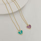 Straight-on to clearly showcase the mini heart pendant with vibrant red enamel and the signature spade detail.