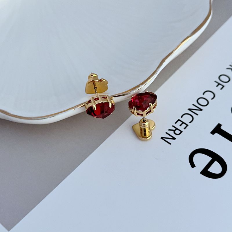 Macro focus on the enamel disc, showcasing the serene blue finish and elegant gold foil script. Alt: “Light Blue Enamel with Gold 'Rise and Shine' Detail – Kate Spade Earrings.”