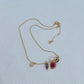 Necklace displayed against a festive background (e.g., evergreen branches, red velvet, or holiday wrapping), highlighting the colorful light bulbs. Alt: “Kate Spade Holiday Light Necklace – Festive Christmas Light Pendant Jewelry.”