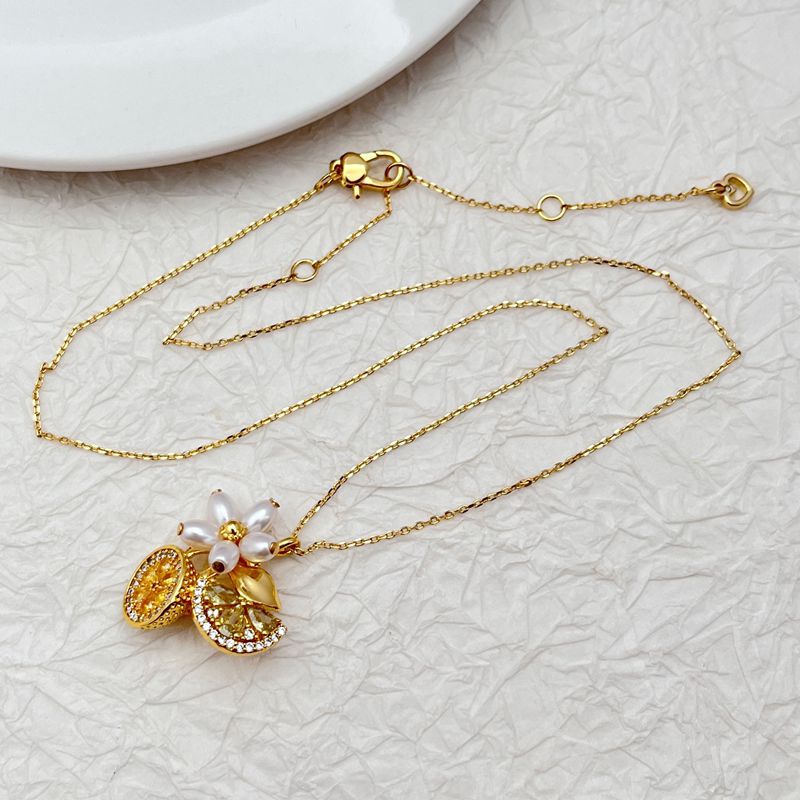 Vibrant, clean shot of the necklace on a light, fresh background (like light green or yellow), highlighting the colorful charms.