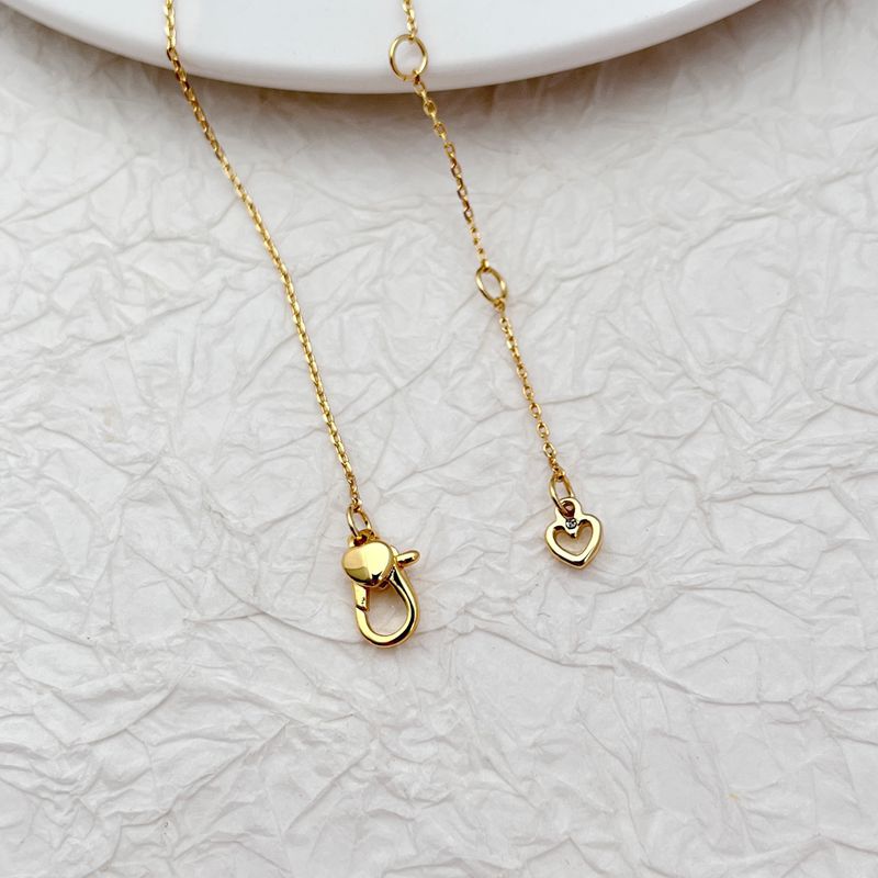 Vibrant, clean shot of the necklace on a light, fresh background (like light green or yellow), highlighting the colorful charms.