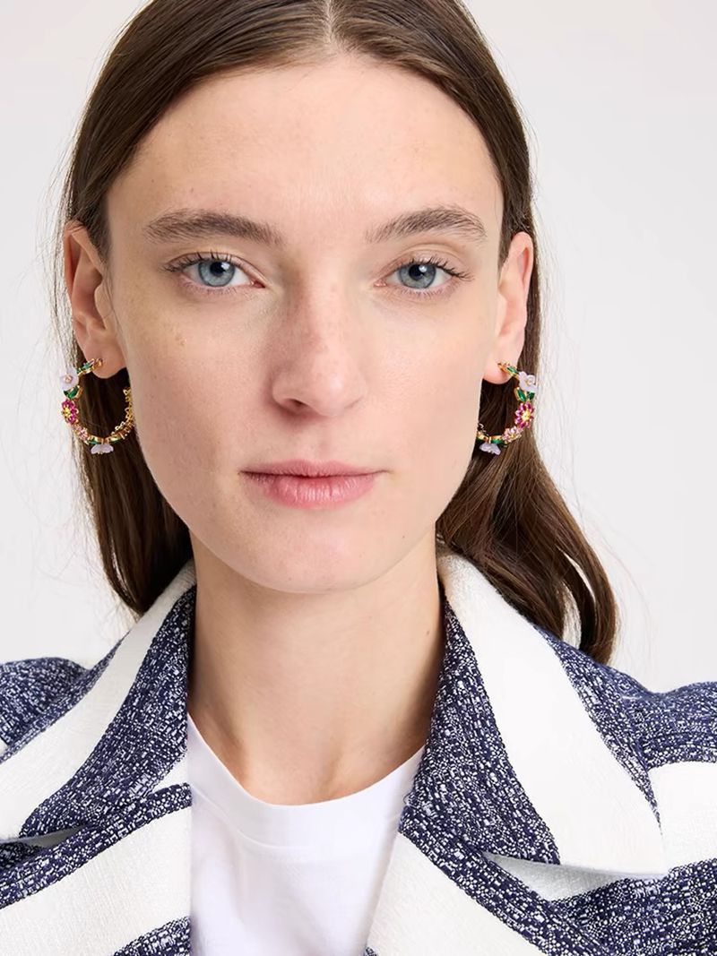 Earrings styled alongside fresh blooms, champagne flutes, or wedding invitations. Alt: “Blooms & Sparkle: Styling the Kate Spade Bursting Blooms Hoop Earrings.”