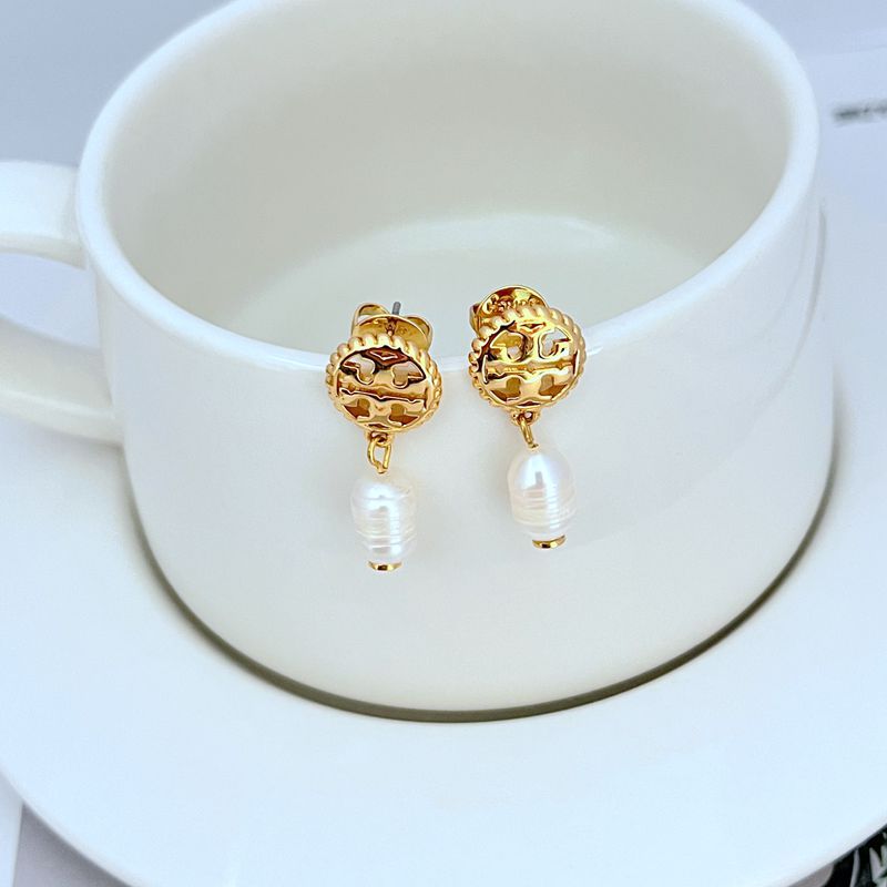 Earrings on a soft sand-beige or seafoam green background, highlighting the warm pink conch pearl and gold setting. Alt: “Kate Spade New York Conch Pearl Gold Tone Earrings – Shell Pearl Drop Jewelry.”