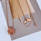  Necklace on a soft gradient or dreamy pastel background, highlighting the flying figure pendant and rose gold glow. Alt: “Kate Spade New York Rose Gold Imagination Flying Necklace – Whimsical Pendant Jewelry.”