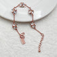  Bracelet on a soft cream or warm terracotta background, emphasizing the warm glow of the orange crystals. Alt: “Kate Spade Lady Marmalade Station Bracelet – Citrine Crystal Jewelry.”