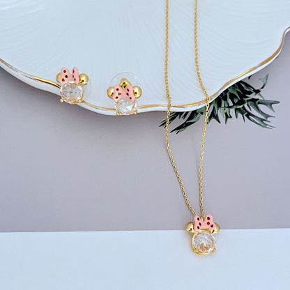 Necklace displayed on a clean, light background (white or pale pink), showing the Minnie slider charm positioned mid-chain. Alt: “Kate Spade New York Minnie Slider Necklace – Disney-Inspired Gold Charm Jewelry.”
