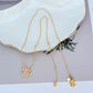 Necklace displayed on a clean, light background (white or pale pink), showing the Minnie slider charm positioned mid-chain. Alt: “Kate Spade New York Minnie Slider Necklace – Disney-Inspired Gold Charm Jewelry.”